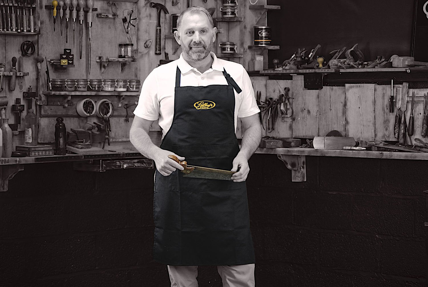 restorer Simon Gilboy in bib apron