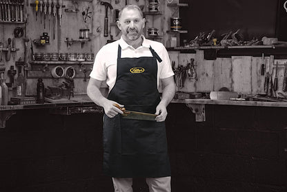 restorer Simon Gilboy in bib apron